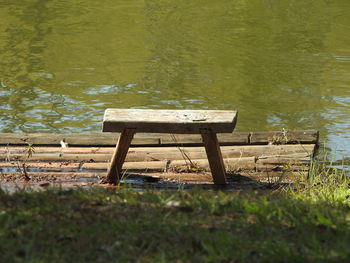 Empty chair on lakeshore