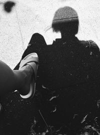 High angle view of woman standing on road