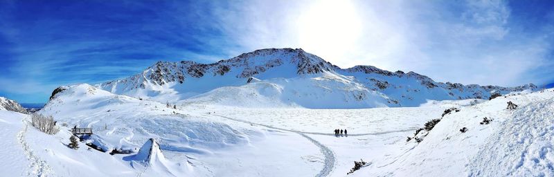 Snow on mountain against sky