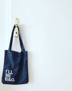 Bag hanging on latch of door