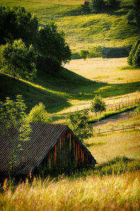 Barn on hill at sunrise