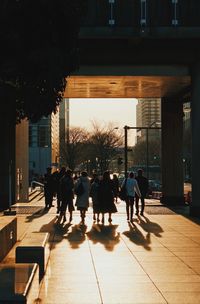 People in city during sunset