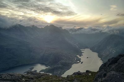 Scenic view of mountains against sky during sunset