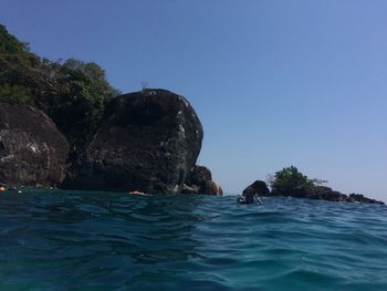 Scenic view of sea against clear blue sky