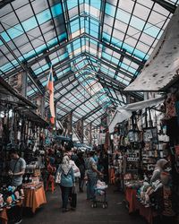 People at market stall in city