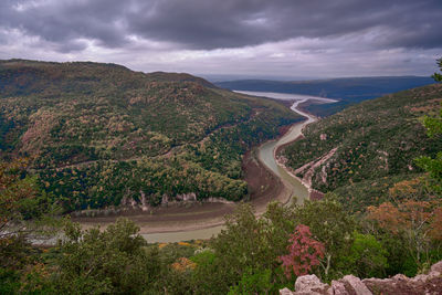 High angle view of road amidst mountains against sky