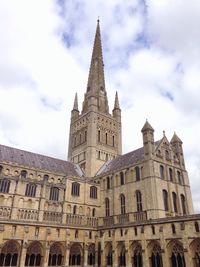 Low angle view of church against cloudy sky