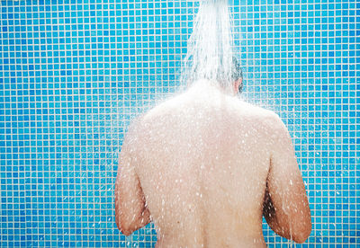 Man swimming in pool