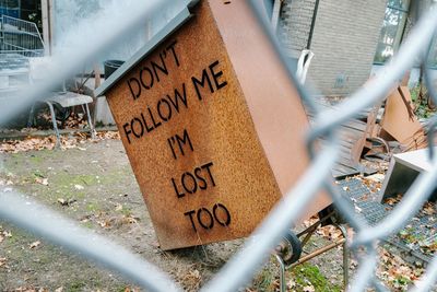 Text on chainlink fence