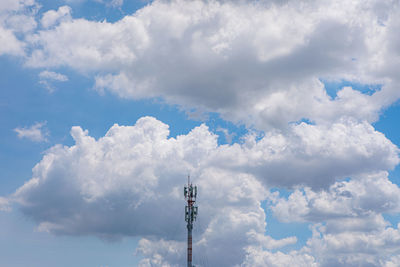 Low angle view of communications tower against sky