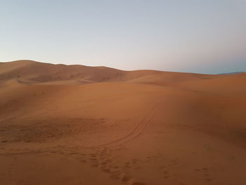 Scenic view of desert against clear sky