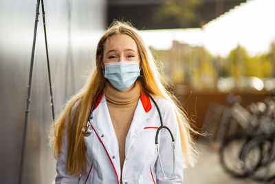 Young woman wearing mask