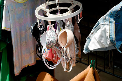 Close-up of clothes hanging for sale