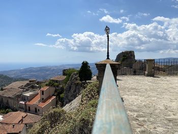 Panoramic view of temple and buildings against sky