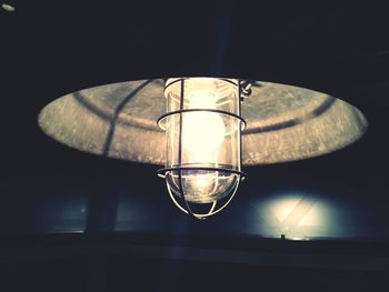 Low angle view of illuminated electric lamp