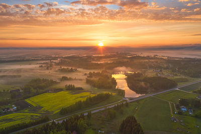 Aerial view of landscape against sky during sunset