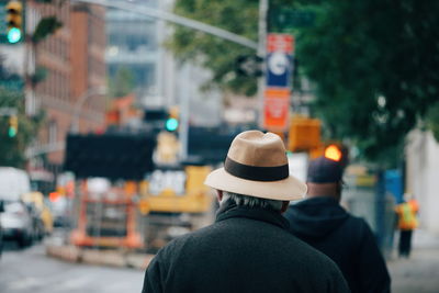 Rear view of man in city street