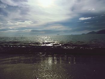 Scenic view of sea against cloudy sky