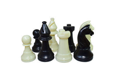 Close-up of chess pieces against white background