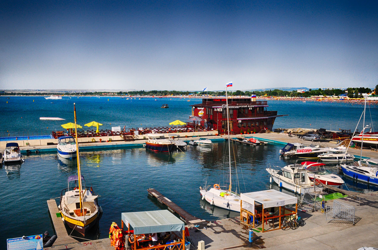 nautical vessel, transportation, mode of transport, boat, moored, water, sea, clear sky, blue, copy space, harbor, travel, pier, outdoors, day, nature, sky, mast, tranquility, built structure