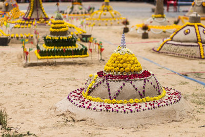 Multi colored flowers in temple outside building