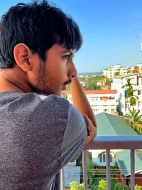 Portrait of young man looking away