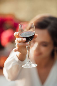 Portrait of woman holding wineglass