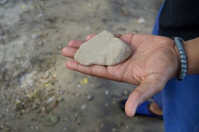 Close-up of man holding hands