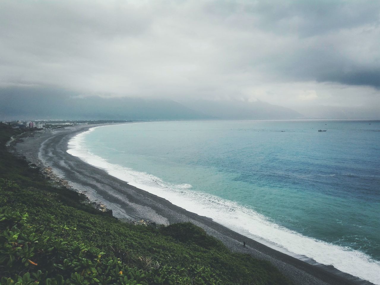 VIEW OF SEA AGAINST CLOUDY SKY