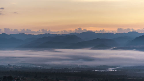 Scenic view of mountains against dramatic sky