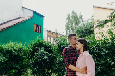 Young couple standing outdoors