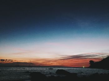 Scenic view of sea against sky at sunset