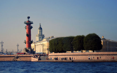 View of building by sea against clear sky