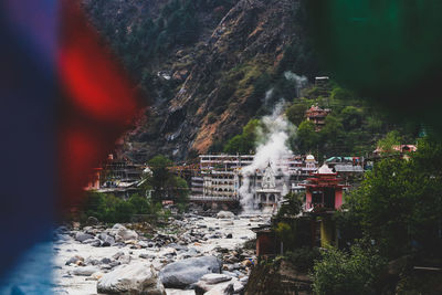 Scenic view of waterfall against sky