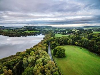 Scenic view of green landscape against sky