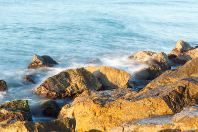 Scenic view of rocks on beach