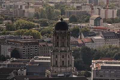 High angle view of trees and buildings in city
