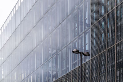 Low angle view of glass window on building