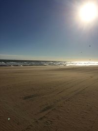 Scenic view of beach against clear sky