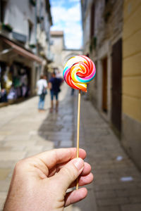 Close-up of hand holding umbrella