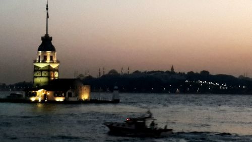 View of illuminated sea at night