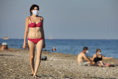 Woman standing on beach