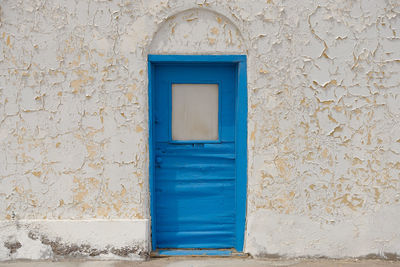 Closed blue door of building