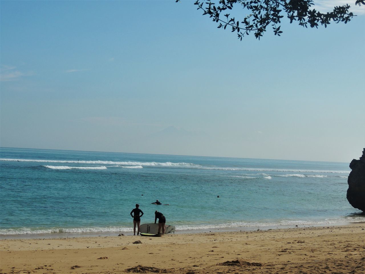 PEOPLE ON BEACH AGAINST SKY