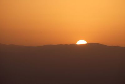 Scenic view of mountains at sunset