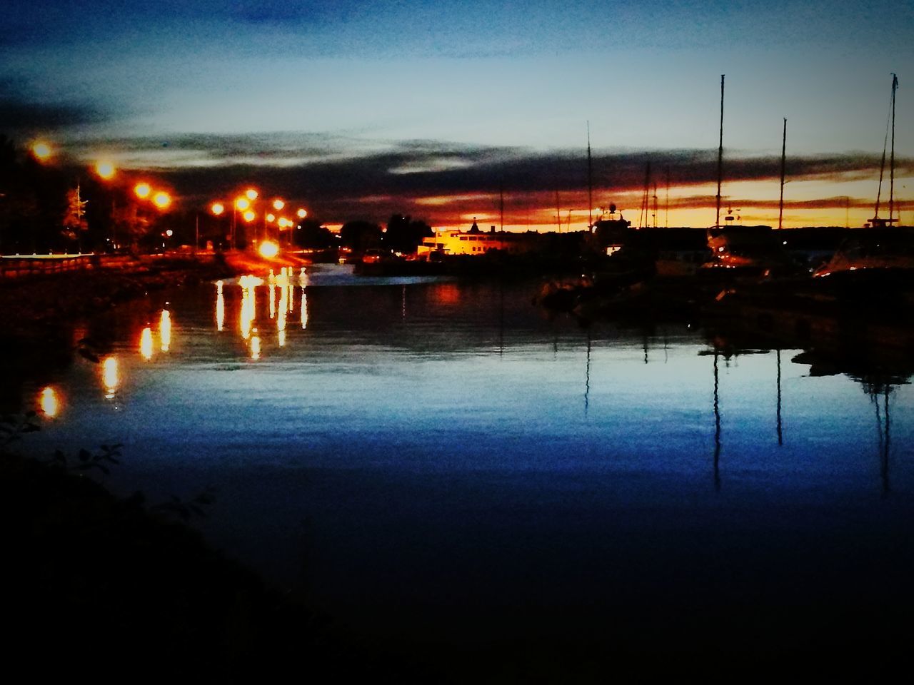 ILLUMINATED LAKE AGAINST SKY AT NIGHT