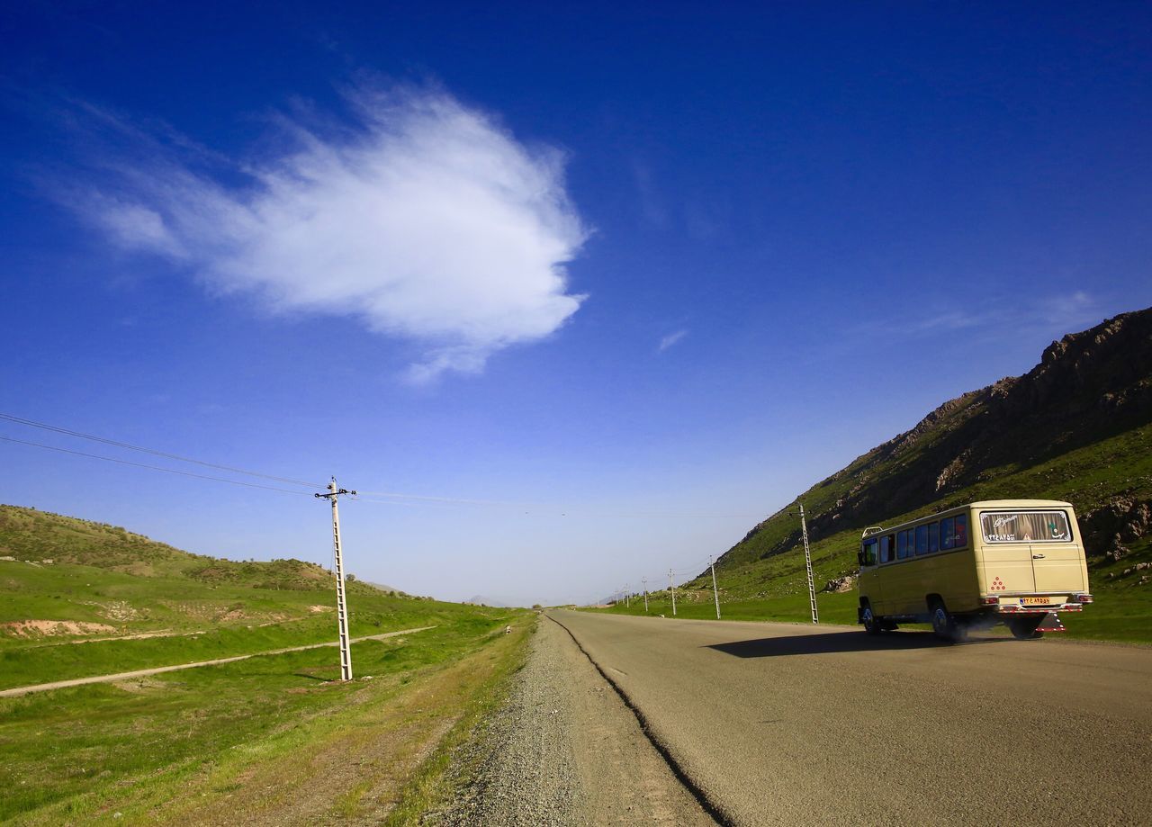 transportation, road, blue, sky, the way forward, solitude, tranquil scene, day, electricity pylon, cloud, countryside, long, diminishing perspective, country road, tranquility, outdoors, scenics, remote, mountain, non-urban scene