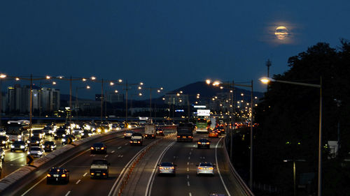 High angle view of vehicles on road at night