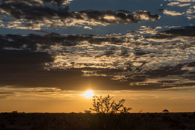 Scenic view of silhouette landscape against sky during sunset