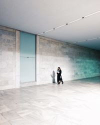 Full length of couple standing in building